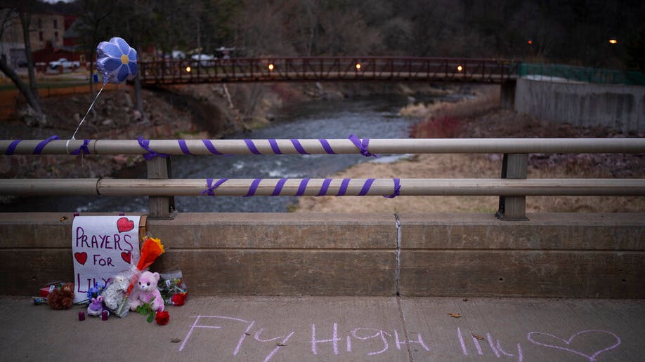 A memorial for 10-year-old Iliana "Lily" Peters is displayed on Jefferson Ave. Monday evening, April 25, 2022, in Chippewa Falls, Wis. Peters was found dead in a park earlier in the day after being reported missing the night before.