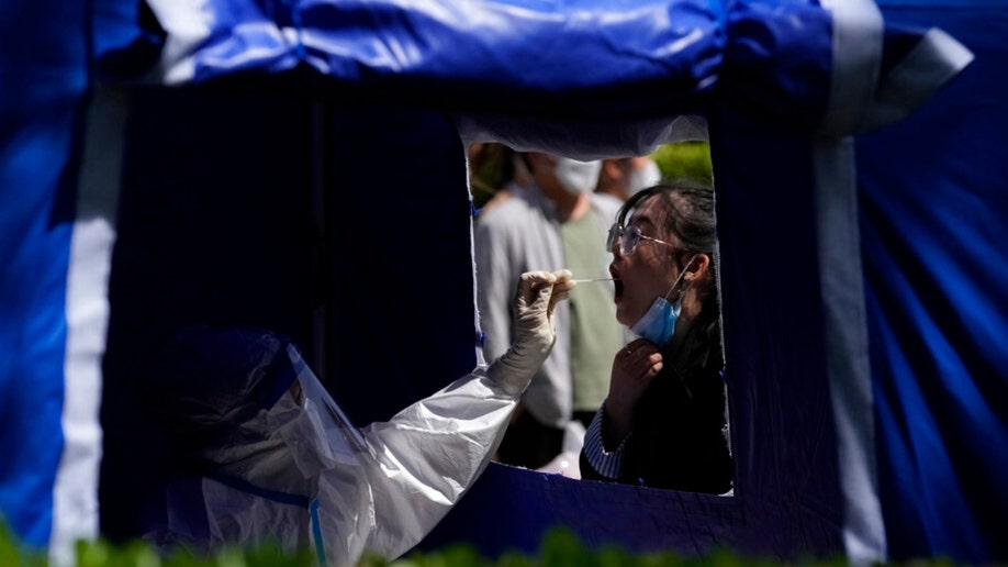 A resident gets tested in Beijing