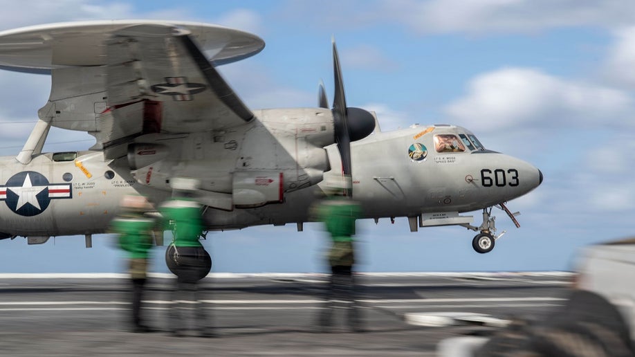 The E-2D Hawkeye on the deck of a Navy carrier.