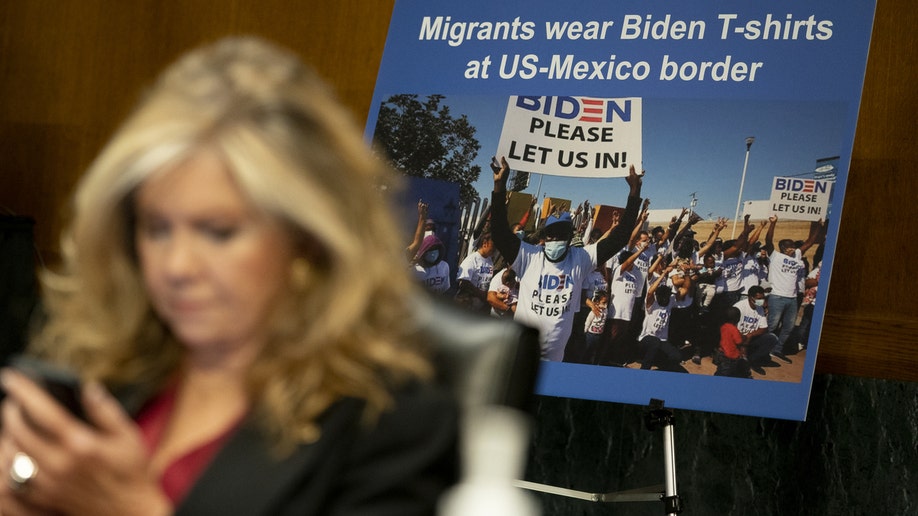 Senator Marsha Blackburn, a Republican of Tennessee, sits in front of a poster showing migrants at the U.S. and Mexico border during a Senate Judiciary Committee hearing in Washington, D.C., U.S., on Tuesday, Nov. 16, 2021.