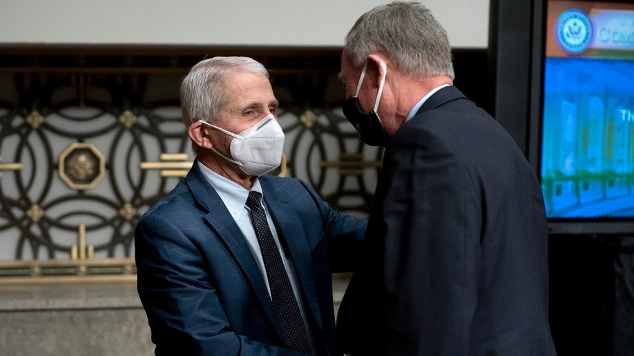 Dr. Anthony Fauci, White House Chief Medical Advisor and Director of the NIAID, greets Sen. Richard Burr (R-NC) after a Senate Health, Education, Labor, and Pensions Committee hearing on Capitol Hill on January 11, 2022 in Washington, D.C. The committee will hear testimony about the federal response to COVID-19 and new, emerging variants. 