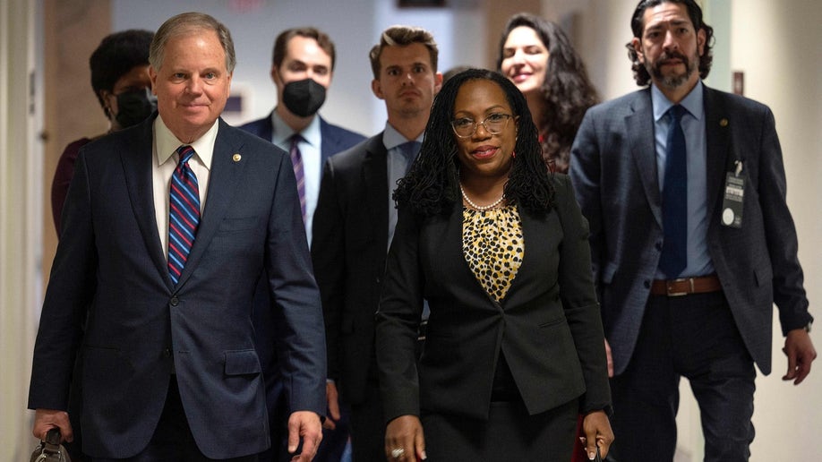 Judge Ketanji Brown Jackson (C) arrives for a meeting with US Senator Sherrod Brown (D-OH) on her nomination to be an associate justice of the Supreme Court of the United States, on Capitol Hill in Washington, DC