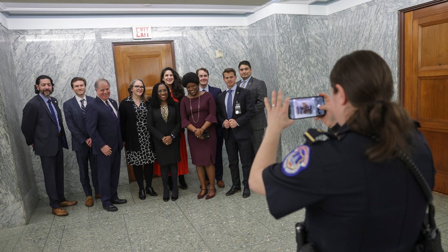 U.S. Supreme Court Nominee Ketanji Brown Jackson takes a photo with her staff and security detail on Capitol Hill, on April 05, 2022 in Washington, DC. Judge Jackson's confirmation vote in the Senate is expected later this week. 
