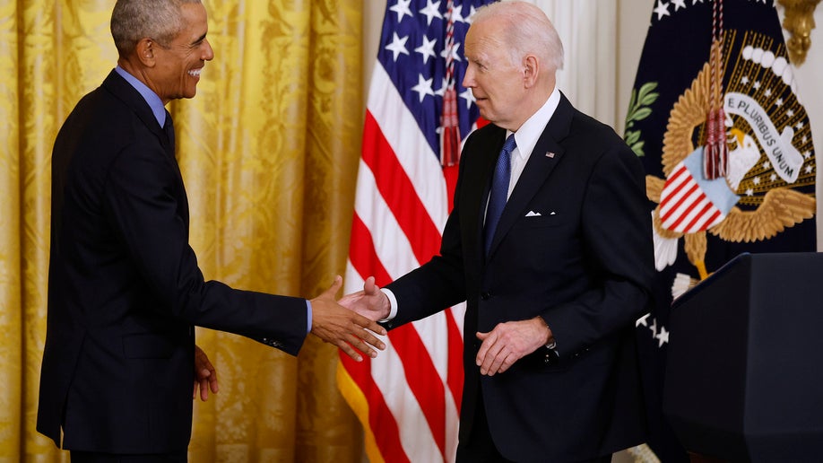 Former President Barack Obama (L) and U.S. President Joe Biden shake hands during an event to mark the 2010 passage of the Affordable Care Act in the East Room of the White House on April 05, 2022 in Washington, DC. With then-Vice President Joe Biden by his side, Obama signed 'Obamacare' into law on March 23, 2010. 