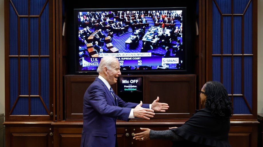 President Joe Biden embraces Ketanji Brown Jackson moments after the she got enough votes in the U.S. Senate to be confirmed as the first Black woman to be a justice on the Supreme Court in the Roosevelt Room at the White House 