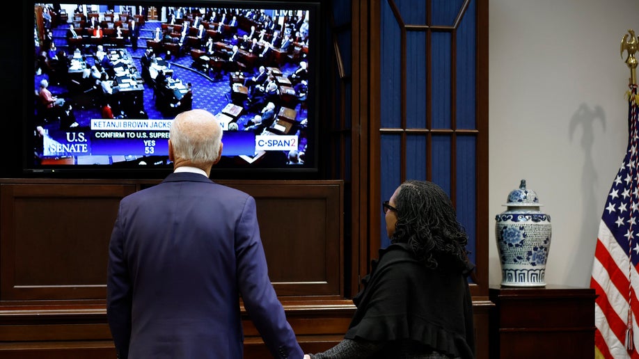 President Joe Biden and Judge Ketanji Brown Jackson watch together as the U.S. Senate votes to confirm her to be the first Black woman to be a justice on the Supreme Court in the Roosevelt Room at the White House