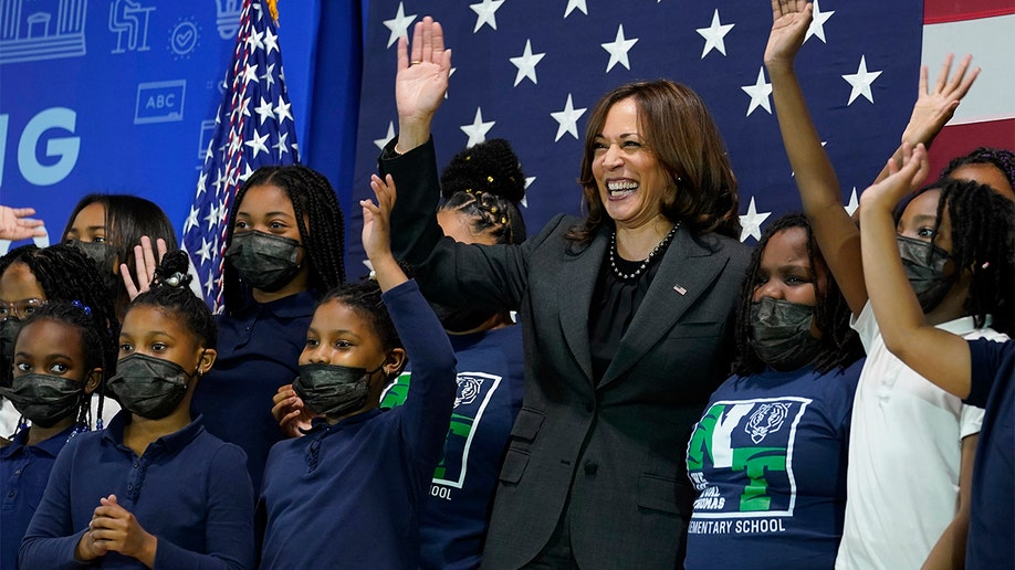 Vice President Kamala Harris poses for a photo with students at Thomas Elementary School in Washington, Monday, April 4, 2022. (AP Photo/Susan Walsh)