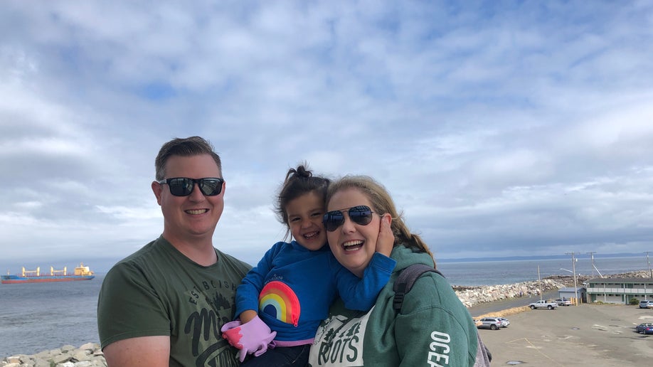 Oakley Carlson and her former foster parents Jamie Jo and Erik Hiles in an undated image.