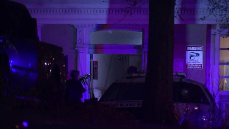 Philadelphia officers outside a home during a standoff