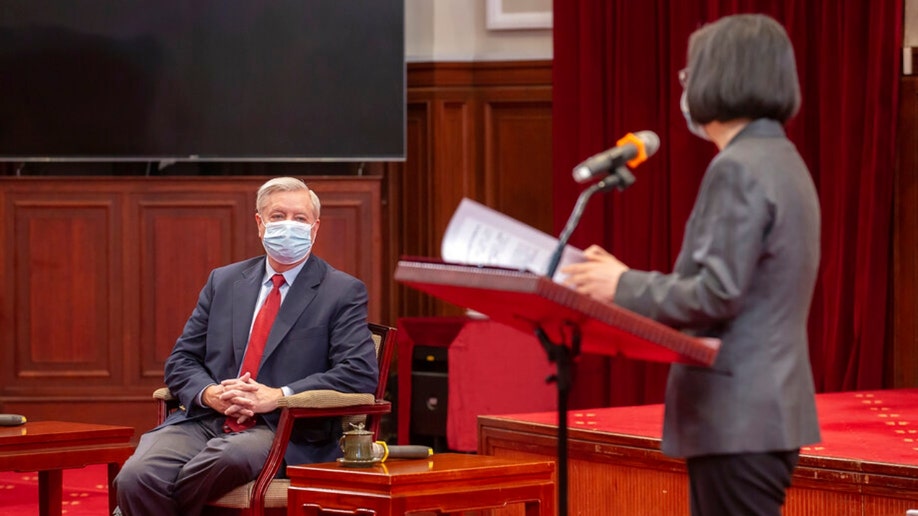 Sen. Lindsey Graham listens to Taiwanese President Tsai Ing-wen speak