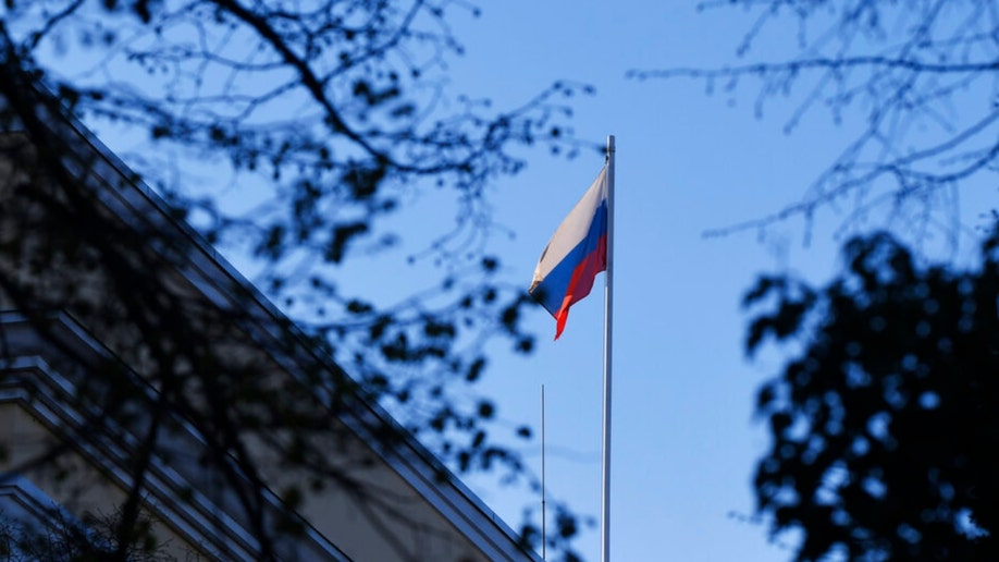 The Russian flag flies over the Russian embassy in Romania.