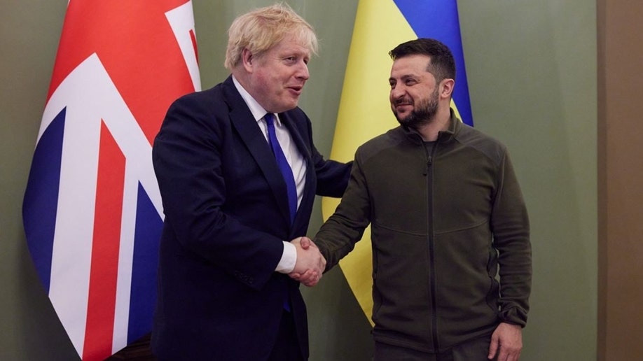 UK. Prime Minister Boris Johnson and Ukrainian President Volodymyr Zelenskyy shake hands