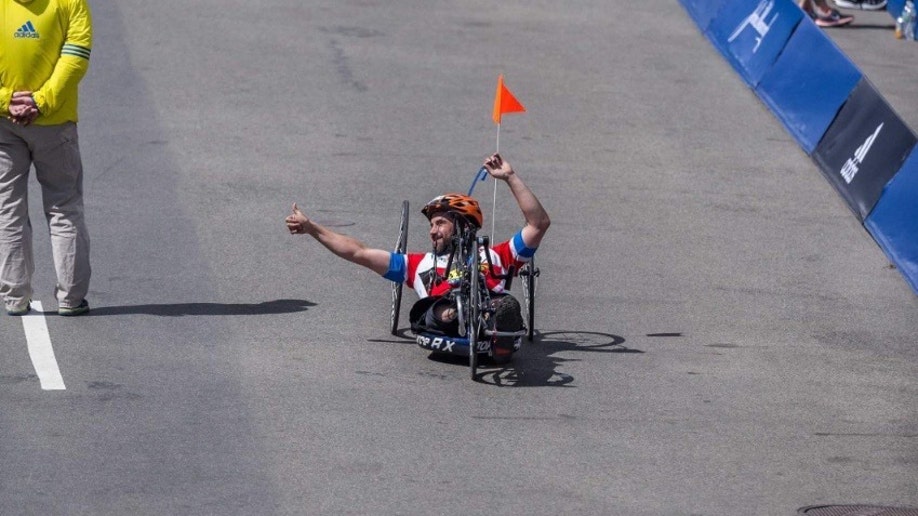 Marc Fucarile crosses boston marathon finish line