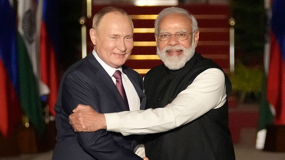 Putin embracing Modi