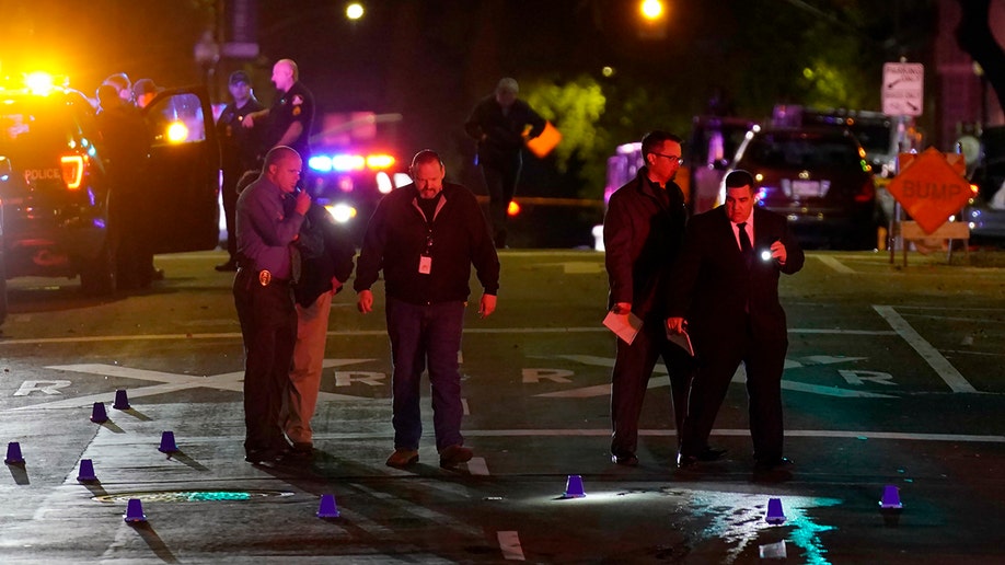 Authorities search area of the scene of a mass shooting with multiple deaths in Sacramento, Calif. Sunday, April 3, 2022.