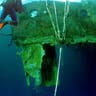 Diver swims to Titanic wreckage