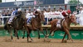 Rich Strike (21), with Sonny Leon aboard, leads Epicenter (3), with Joel Rosario aboard, and Zandon (10), with Flavien Prat aboard, down the straightaway to win the 148th running of the Kentucky Derby horse race at Churchill Downs Saturday, May 7, 2022, in Louisville, Ky.