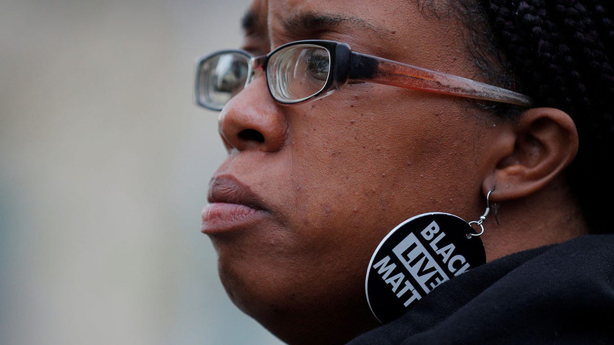BLM activist Monica Cannon-Grant wears Black Lives Matter earrings