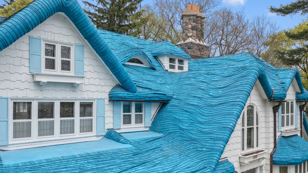 A closeup view of the Smurf House's blue Cotswold cottage style roof shingles.