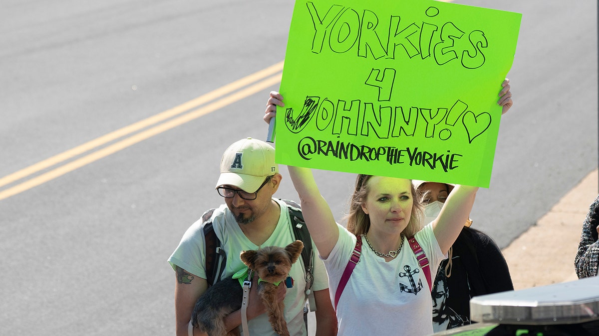 Johnny depp fan holding support sign