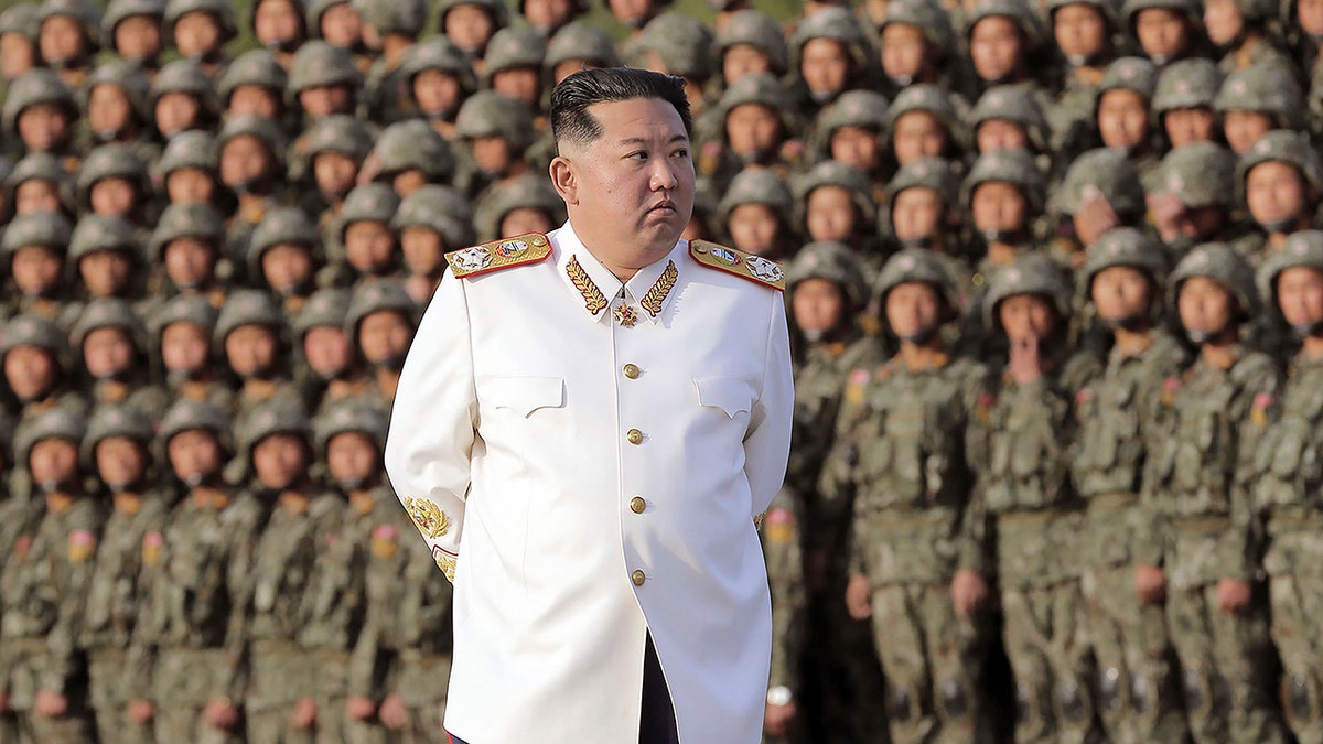 North Korean leader Kim Jong Un attends a photo session with the officers and soldiers who took part in a celebration the 90th founding anniversary of the Korean People's Revolutionary Army, in North Korea Wednesday, April 27, 2022.