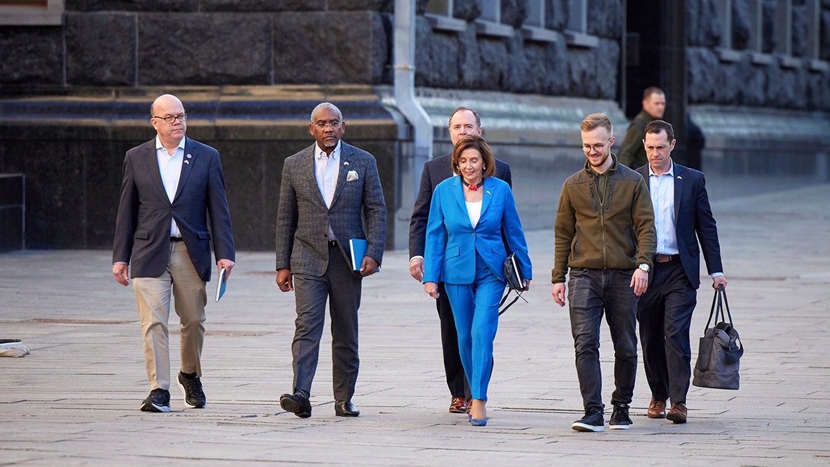 In this image released by the Ukrainian Presidential Press Office on Sunday, May 1, 2022, U.S. Speaker of the House Nancy Pelosi, center, arrives with her delegation before her meeting with Ukrainian President Volodymyr Zelenskyy, in Kyiv, Ukraine, Saturday, April 30, 2022. Pelosi, second in line to the presidency after the vice president, is the highest-ranking American leader to visit Ukraine since the start of the war, and her visit marks a major show of continuing support for the country's struggle against Russia.  