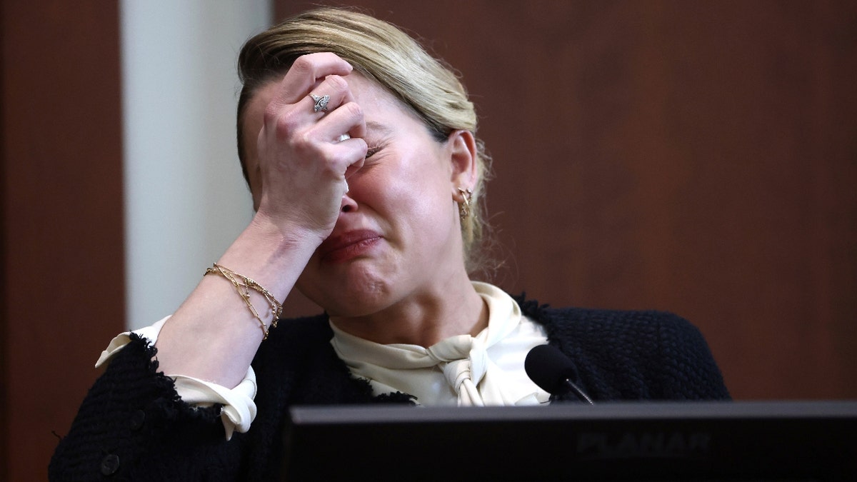 US actress Amber Heard reacts as she testifies during the 50 million US dollar Depp vs Heard defamation trial at the Fairfax County Circuit Court in Fairfax, Virginia, USA, 05 May 2022. Johnny Depp's 50 million US dollar defamation lawsuit against Amber Heard that started on 10 April is expected to last five or six weeks.