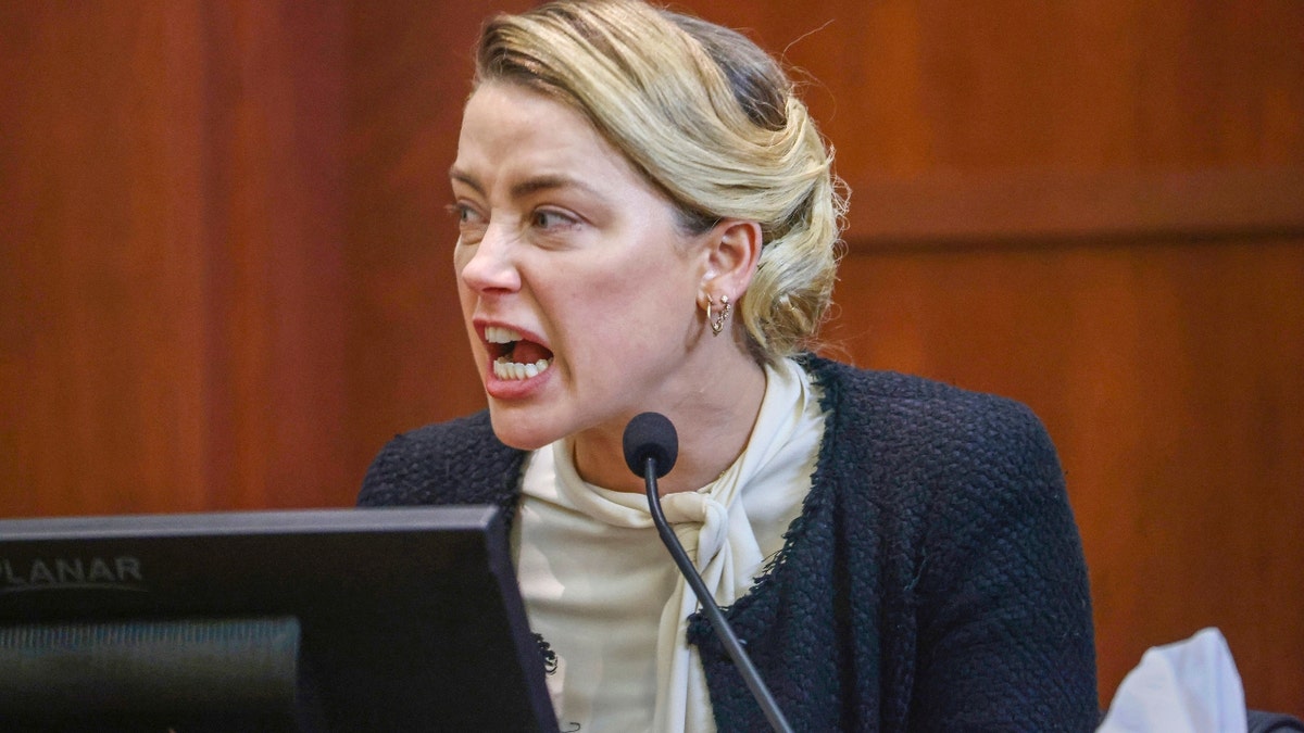 US actress Amber Heard reacts as she testifies during the 50 million US dollar Depp vs Heard defamation trial at the Fairfax County Circuit Court in Fairfax, Virginia, USA, 05 May 2022. Johnny Depp's 50 million US dollar defamation lawsuit against Amber Heard that started on 10 April is expected to last five or six weeks.