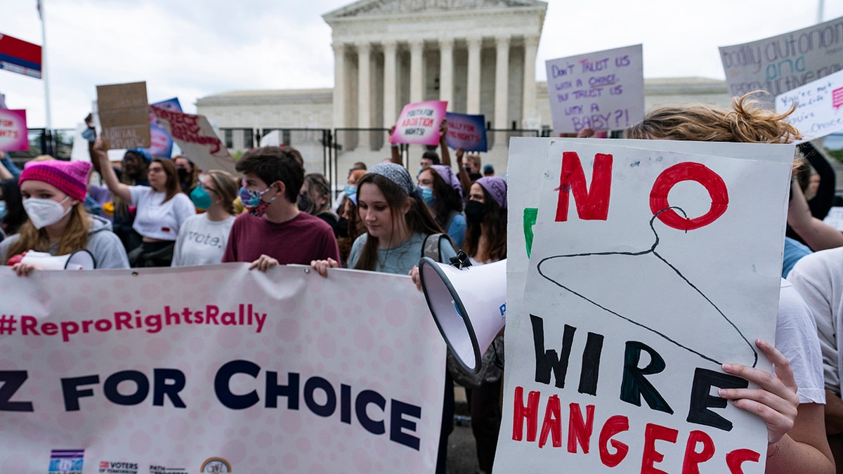 Demonstrators protest outside of the U.S. Supreme Court Thursday, May 5, 2022 in Washington.