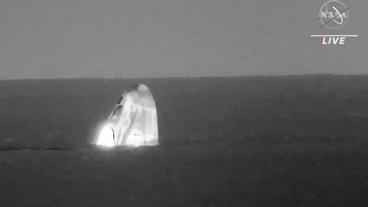 In this image made from video supplied by NASA, SpaceX Dragon space capsule splashes down in the Gulf of Mexico early Friday, May 6, 2022.