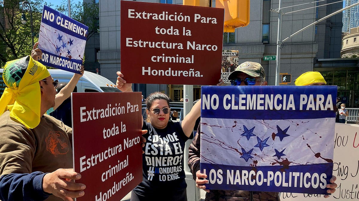 Demonstrators stand outside Manhattan federal court to protest former Honduran President Juan Orlando Hernandez, who pleaded not guilty to charges that he received millions of dollars from 2004 to 2022 to support a drug trade that delivered hundreds of thousands of kilos of drugs to the U.S., Tuesday, May 10, 2022, in New York.?