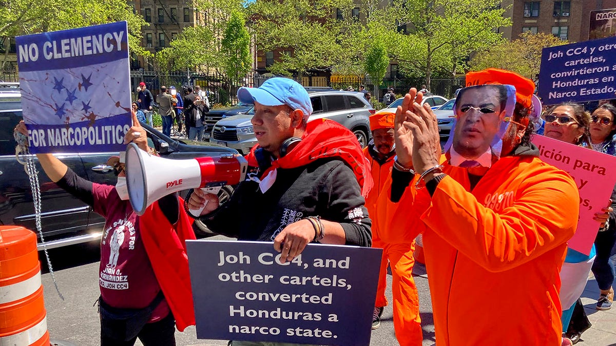 Demonstrators gather outside Manhattan federal court to protest former Honduran President Juan Orlando Hernandez, who pleaded not guilty to charges that he received millions of dollars from 2004 to 2022 to support a drug trade that delivered hundreds of thousands of kilos of drugs to the U.S., Tuesday, May 10, 2022, in New York. 
