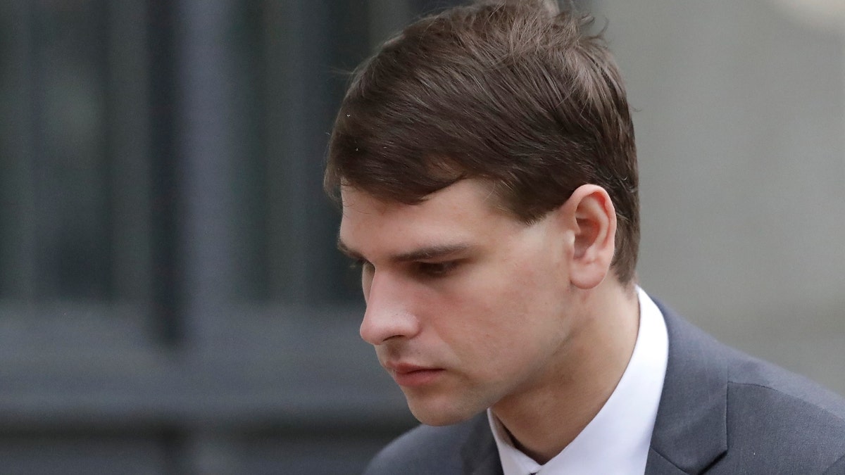 Nathan Carman departs federal court, Wednesday, Aug. 21, 2019, in Providence, R.I. Carman faces civil charges in federal court over insurance issues regarding the boat aboard which he and his mother went out to sea for a night of fishing in 2016. The boat sank, Carman survived but his mother was never found.