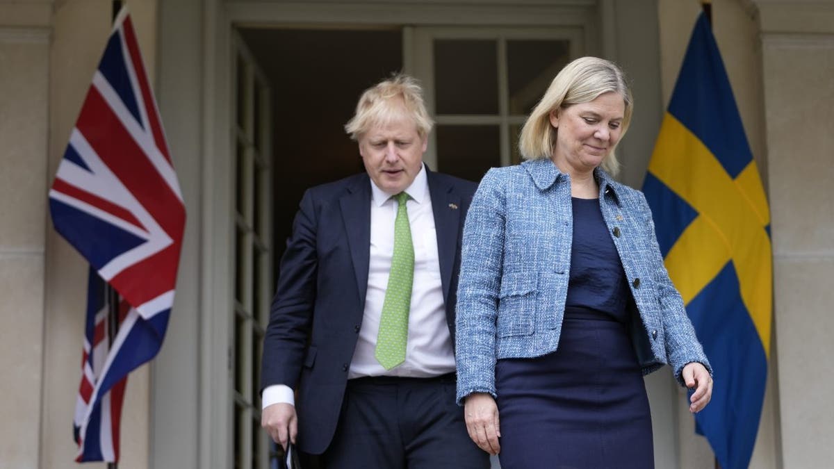 British Prime Minister Boris Johnson, left, and Sweden's Prime Minister Magdalena Andersson arrive for a joint press conference in Harpsund, the country retreat of Swedish prime ministers, Wednesday, May 11, 2022. 
