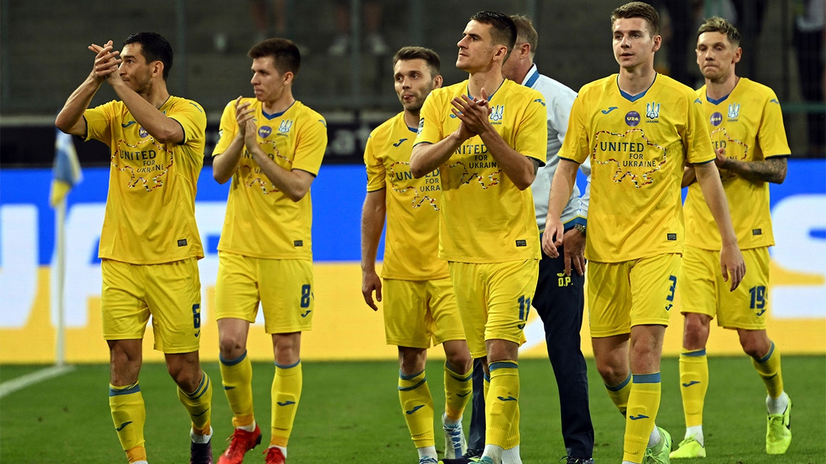 Ukraine players applaud the fans during the soccer match between Borussia Moenchengladbach and Ukraine's national soccer team at Borussia Park, Monchengladbach, Germany, Wednesday May 11, 2022. 