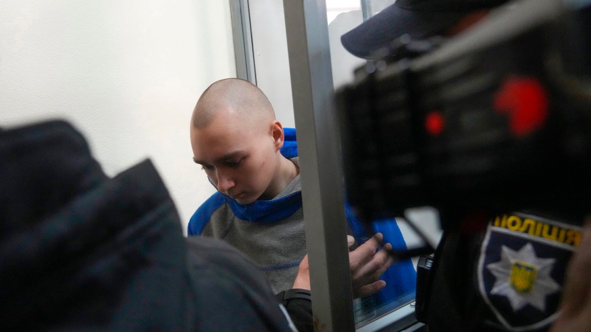 Russian army Sergeant Vadim Shishimarin, 21, arrives for a court hearing in Kyiv, Ukraine, Friday, May 13, 2022. The trial of a Russian soldier accused of killing a Ukrainian civilian opened Friday, the first war crimes trial since Moscow's invasion of its neighbor. (AP Photo/Efrem Lukatsky)