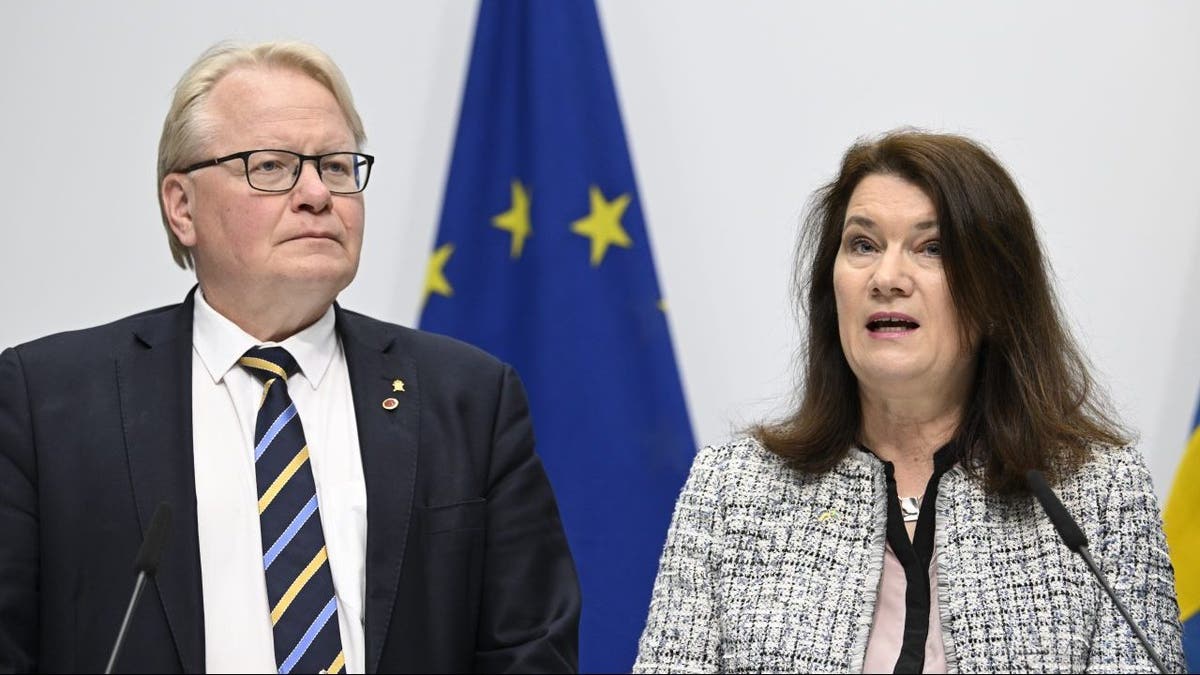 Minister of Defense Peter Hultqvist, left, and Minister of Foreign Affairs Ann Linde present a security policy analysis during a press conference in Stockholm, Sweden, Friday May 13, 2022. 