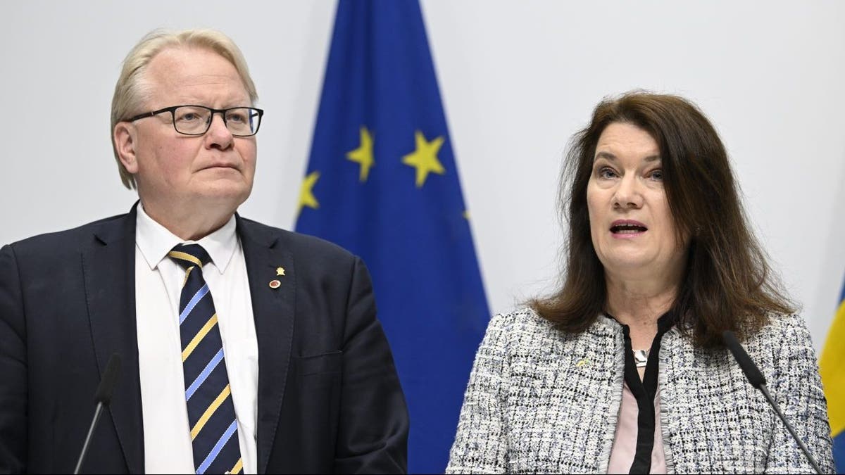 Minister of Defense Peter Hultqvist, left, and Minister of Foreign Affairs Ann Linde present a security policy analysis during a press conference in Stockholm, Sweden, Friday May 13, 2022.