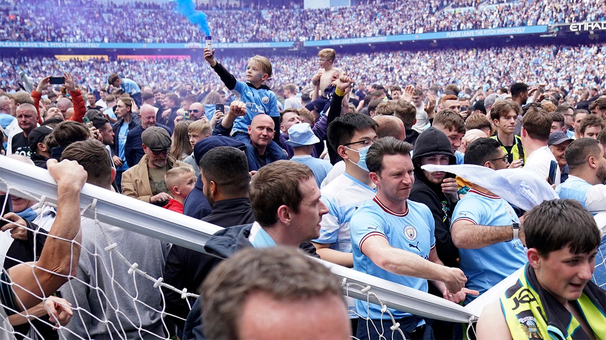 Manchester City fans pitch invasion