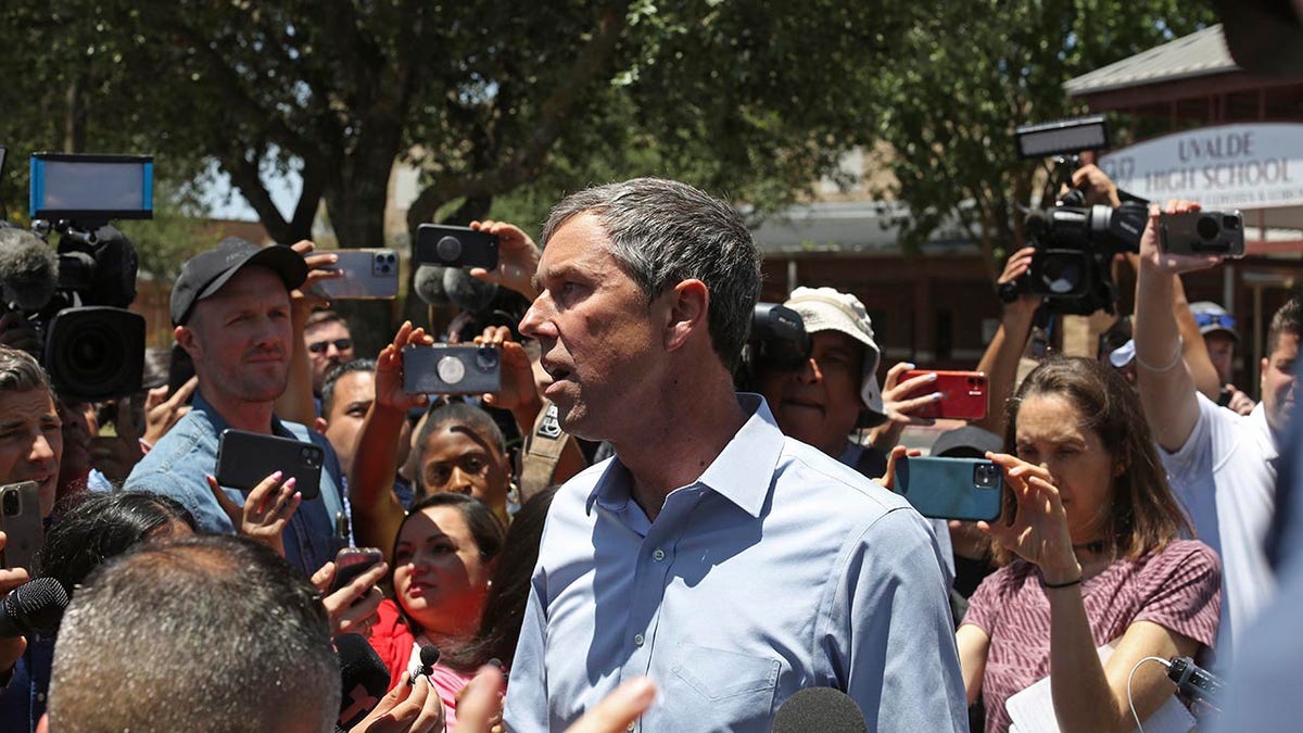 Beto O'Rourke talks to reporters