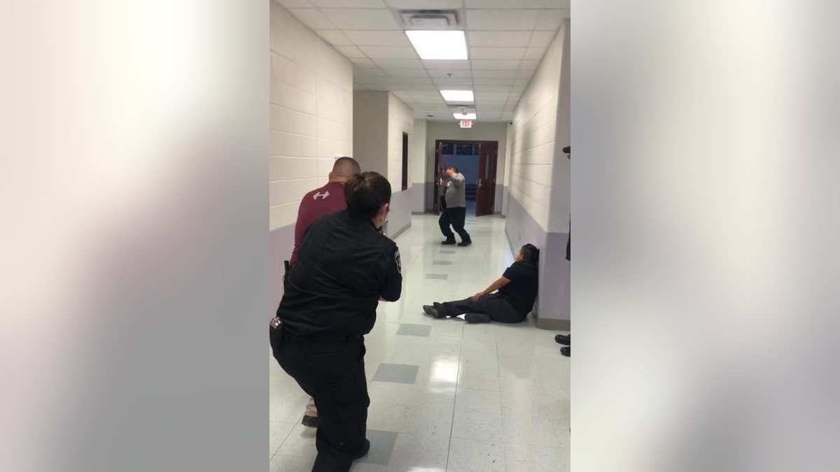 Police officers practice during an active shooter drill