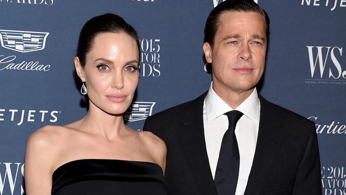 Angelina Jolie and Brad Pitt look stoic on red carpet together