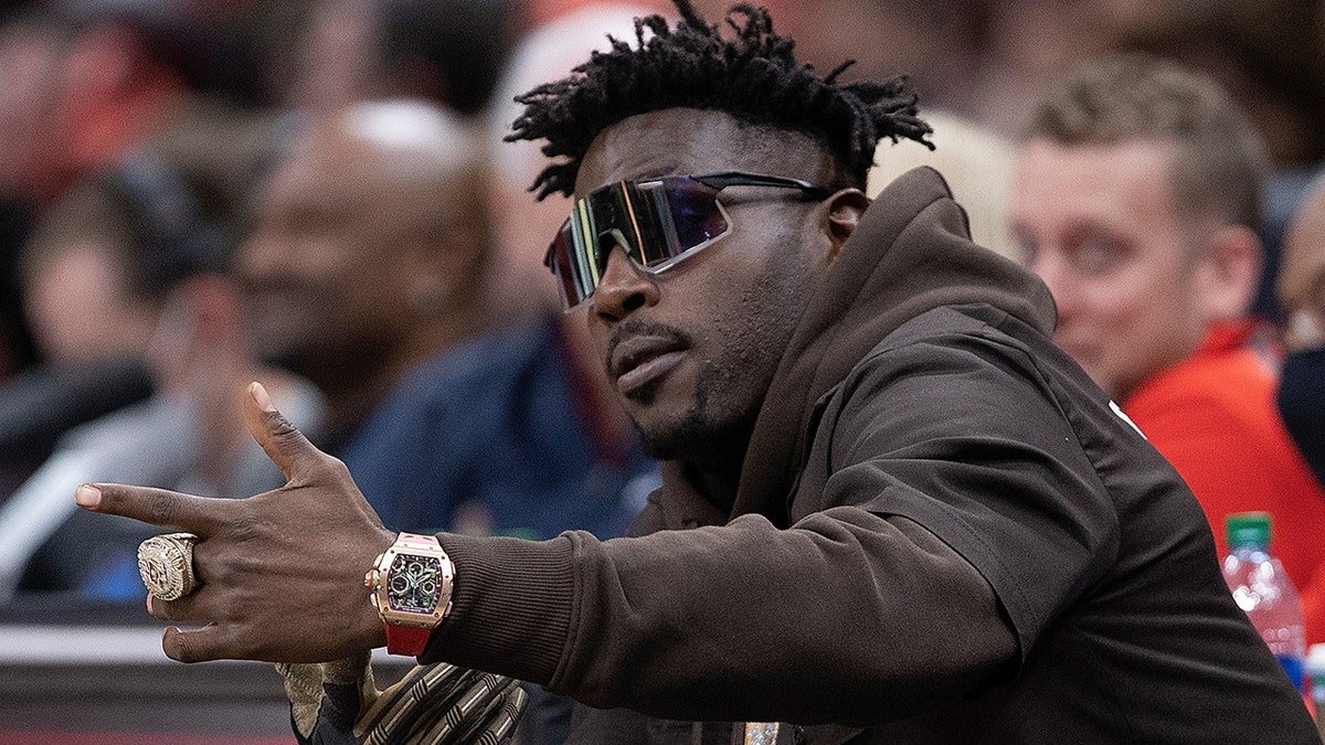 NFL player Antonio Brown looks on during the second half of the game between the Atlanta Hawks and the Los Angeles Clippers at State Farm Arena on March 11, 2022 in Atlanta.