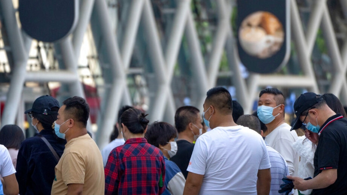 Beijing residents in line for a COVID test