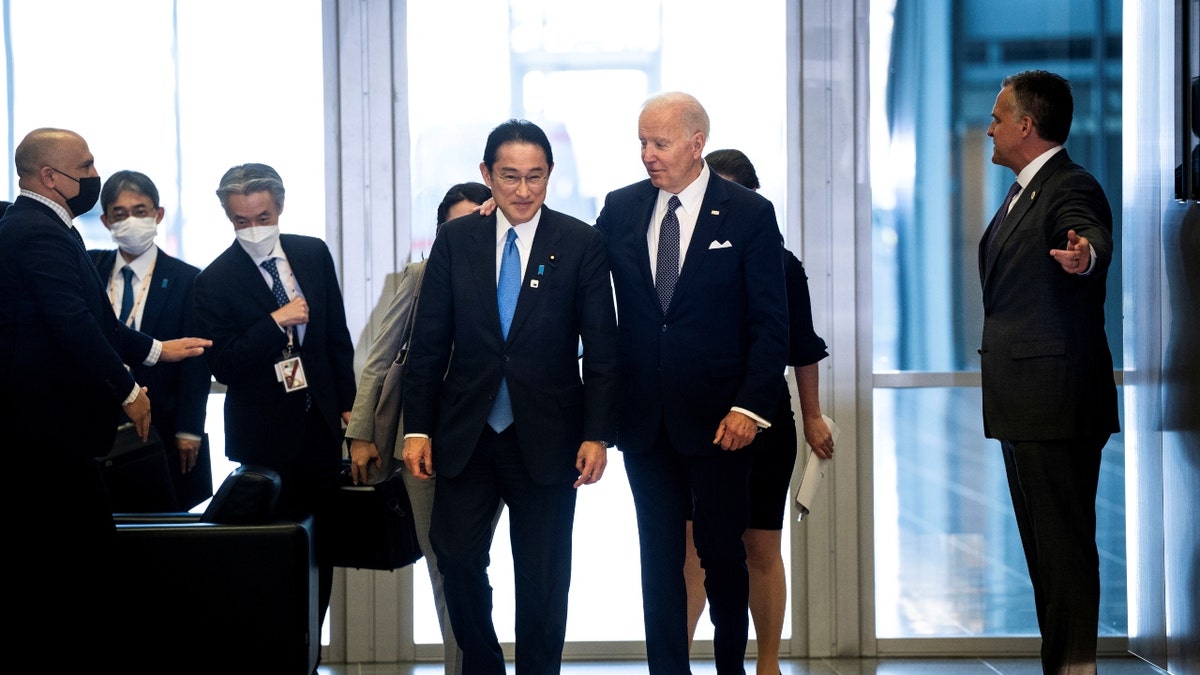 Japanese Prime Minister Fumio Kishida and President Biden walk together