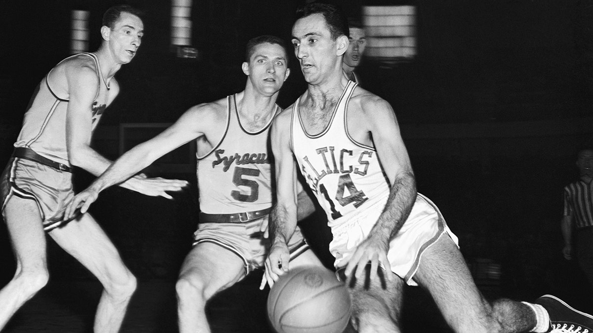 Bob Cousy dribbles