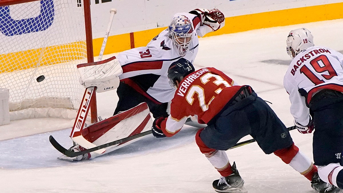 Florida Panthers center Carter Verhaeghe (23) scores a goal against Washington Capitals goaltender Ilya Samsonov (30) during the third period of Game 5 of the first round of the NHL Stanley Cup hockey playoffs, Wednesday, May 11, 2022, in Sunrise, Fla. 