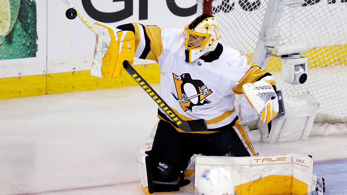 Pittsburgh Penguins goaltender Casey DeSmith makes a save against the New York Rangers in overtime of Game 1 of an NHL hockey Stanley Cup first-round playoff series, Tuesday, May 3, 2022, in New York. 