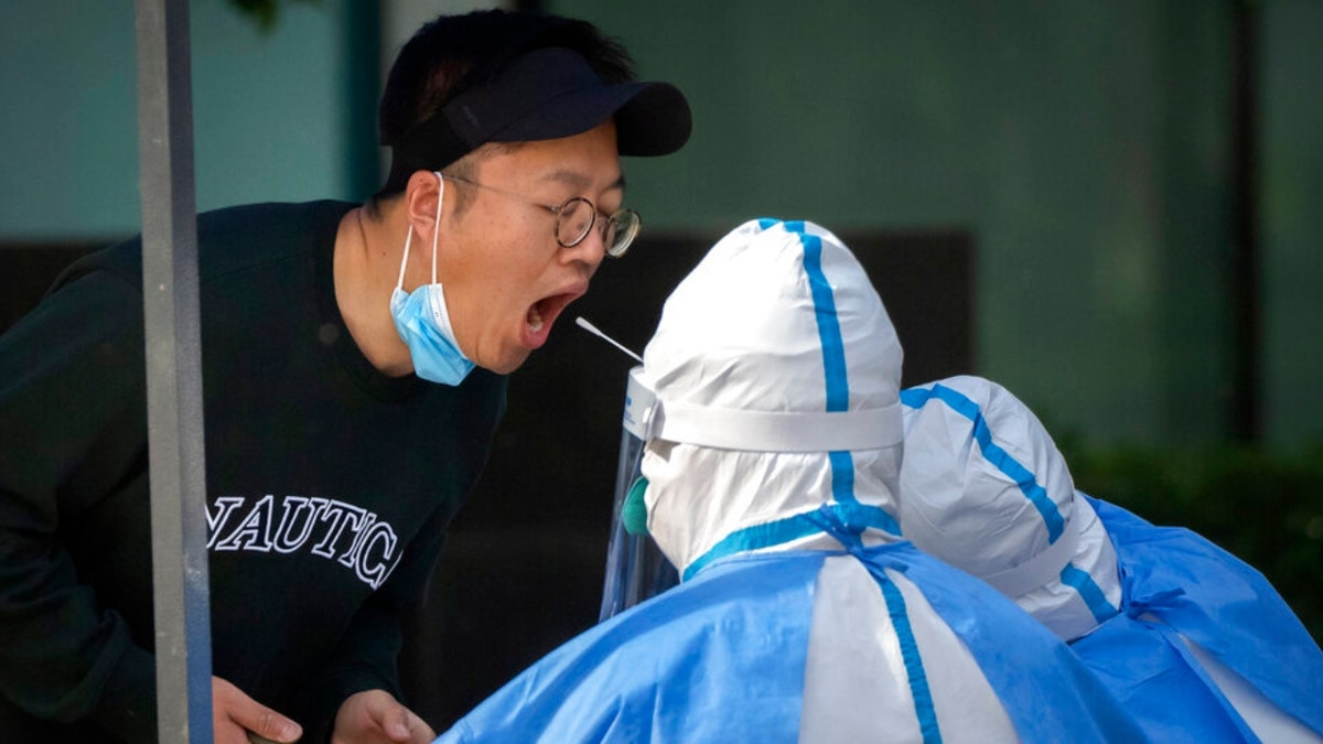 A man takes a COVID test in Beijing