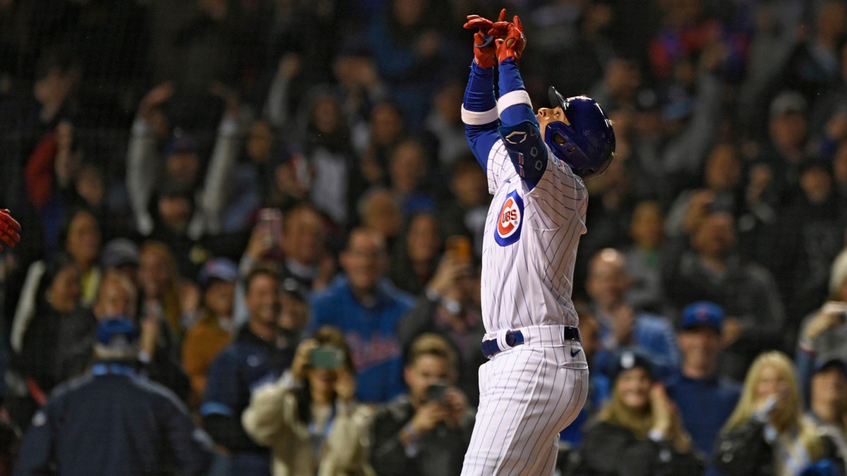 Christopher Morel #5 of the Chicago Cubs hits a single during the